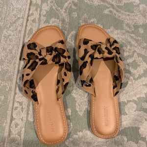 Old Navy slip on leopard print flip flops.